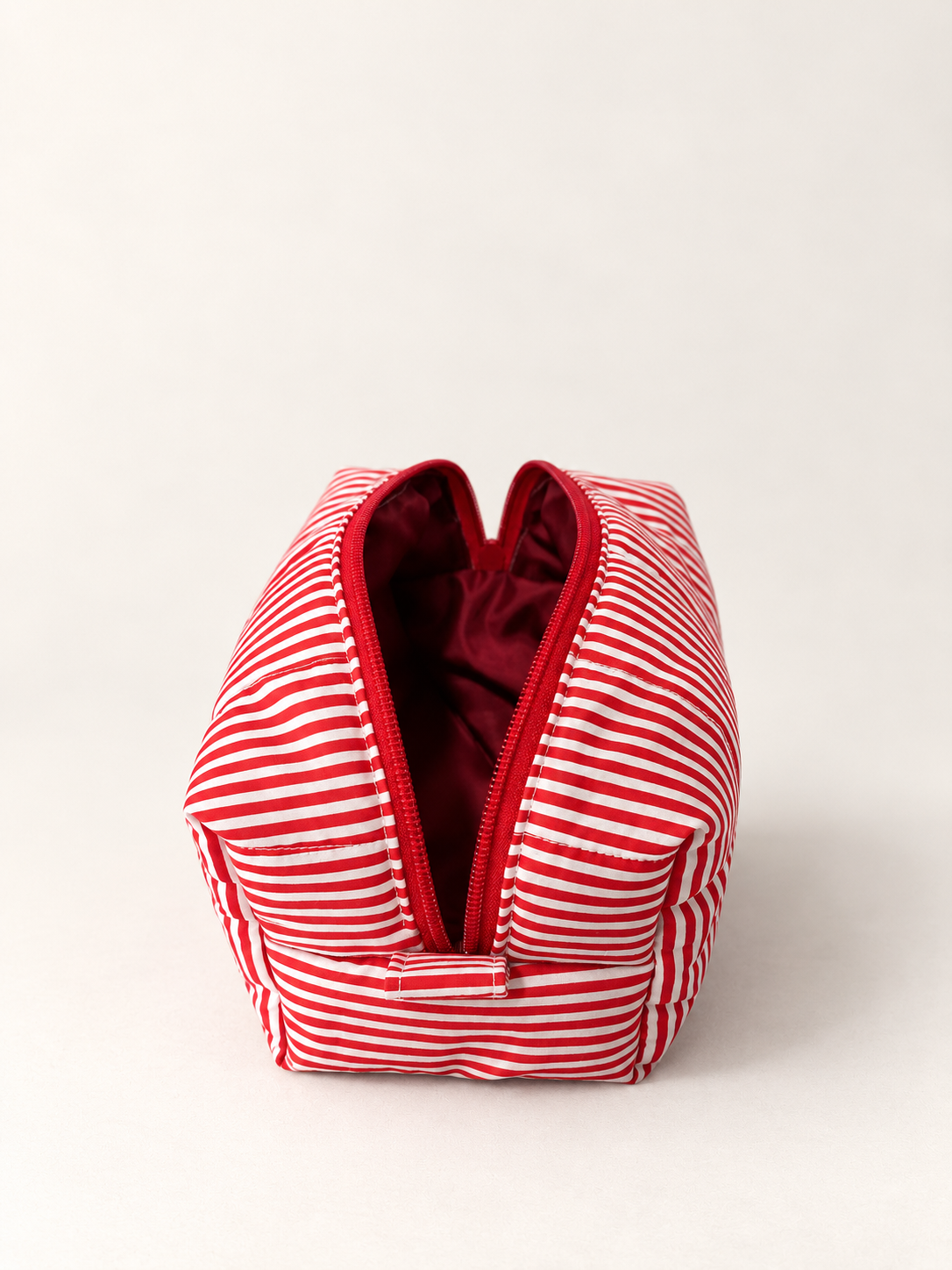Cool Cat makeup bag open top showing burgundy interior