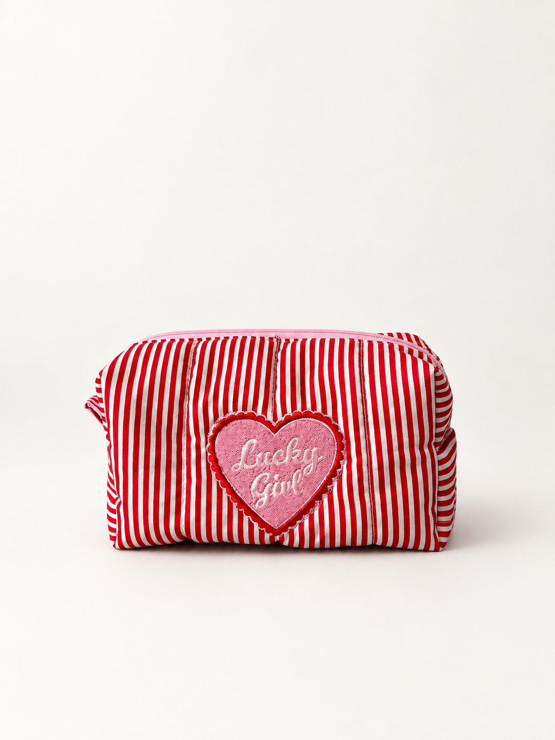 Lucky Girl red and white striped makeup bag, front view with pink embroidered heart badge